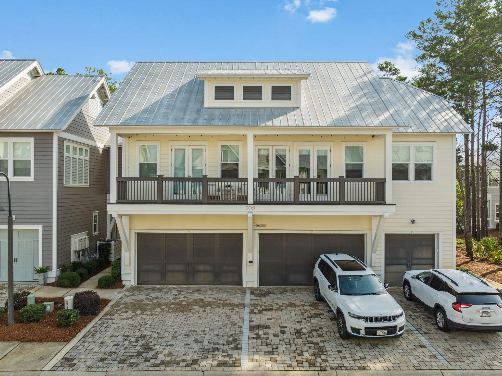 309 Milestone Dr Inlet Beach, Unit A Inlet Beach, FL 32461 - Photo 40 of 54 a view of a patio with table and chairs and potted plants