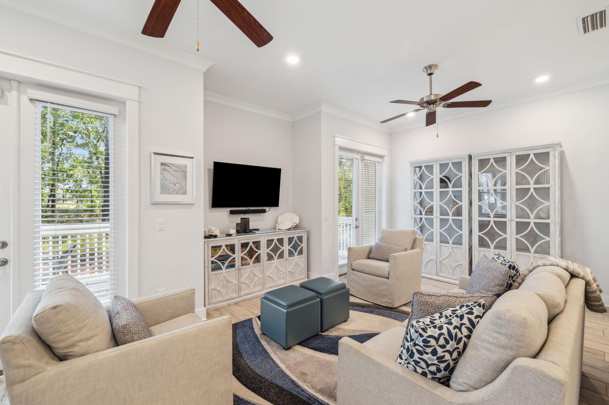 309 Milestone Dr Inlet Beach, Unit A Inlet Beach, FL 32461 - Photo 8 of 54 a living room with furniture a ceiling fan and a window