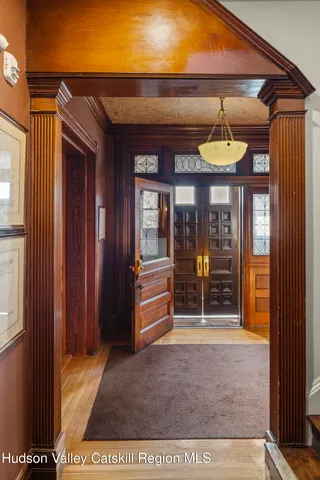 a view of a house with a door and wooden floor