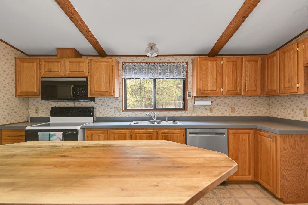 16214 Hawks Lair Road La Pine, OR 97739 - Photo 9 of 25 Kitchen has range/oven, D/W and Microwave.