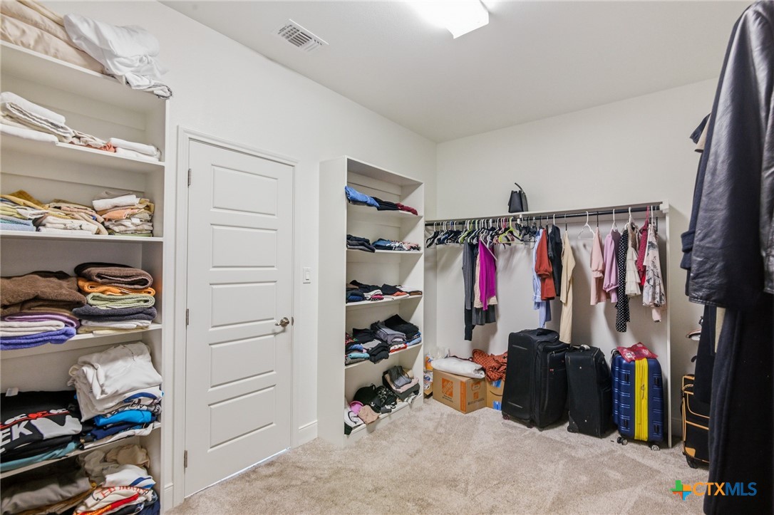 113 Terra Vista Ranch Road Victoria, TX 77904 - Photo 27 of 47 a view of walk in closet with clothes and shoes