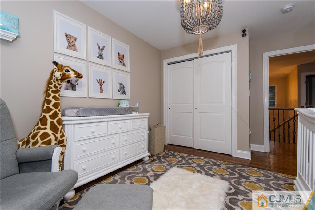 42 Idlewild Road Edison, NJ 08817 - Photo 29 of 43 a bedroom with a bed and wooden floor