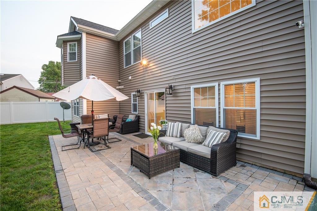 42 Idlewild Road Edison, NJ 08817 - Photo 43 of 43 a view of a patio with couches and potted plants