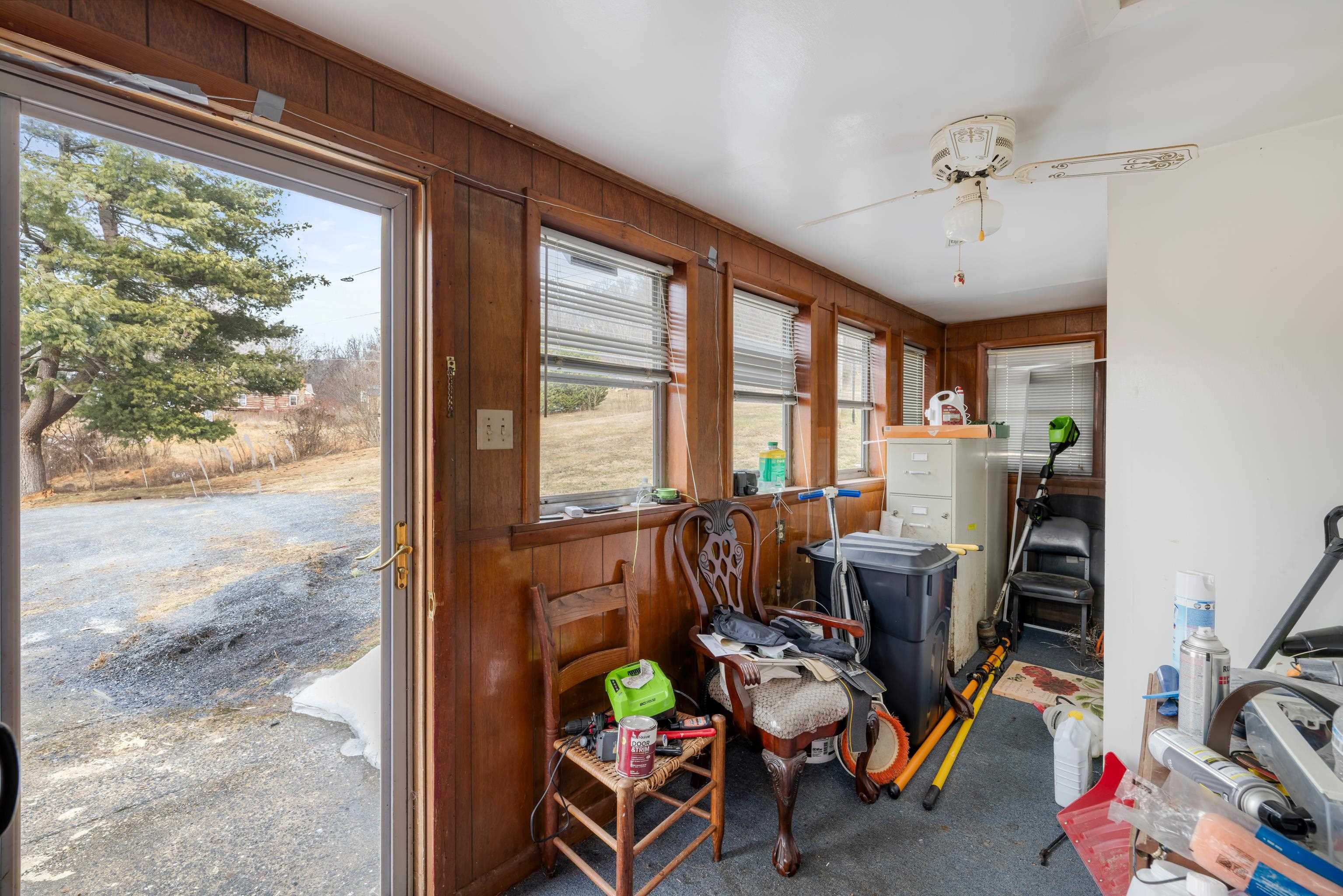 394 Ridge Road Raphine, VA 24472 - Photo 11 of 46 a view of a workspace with furniture and a window