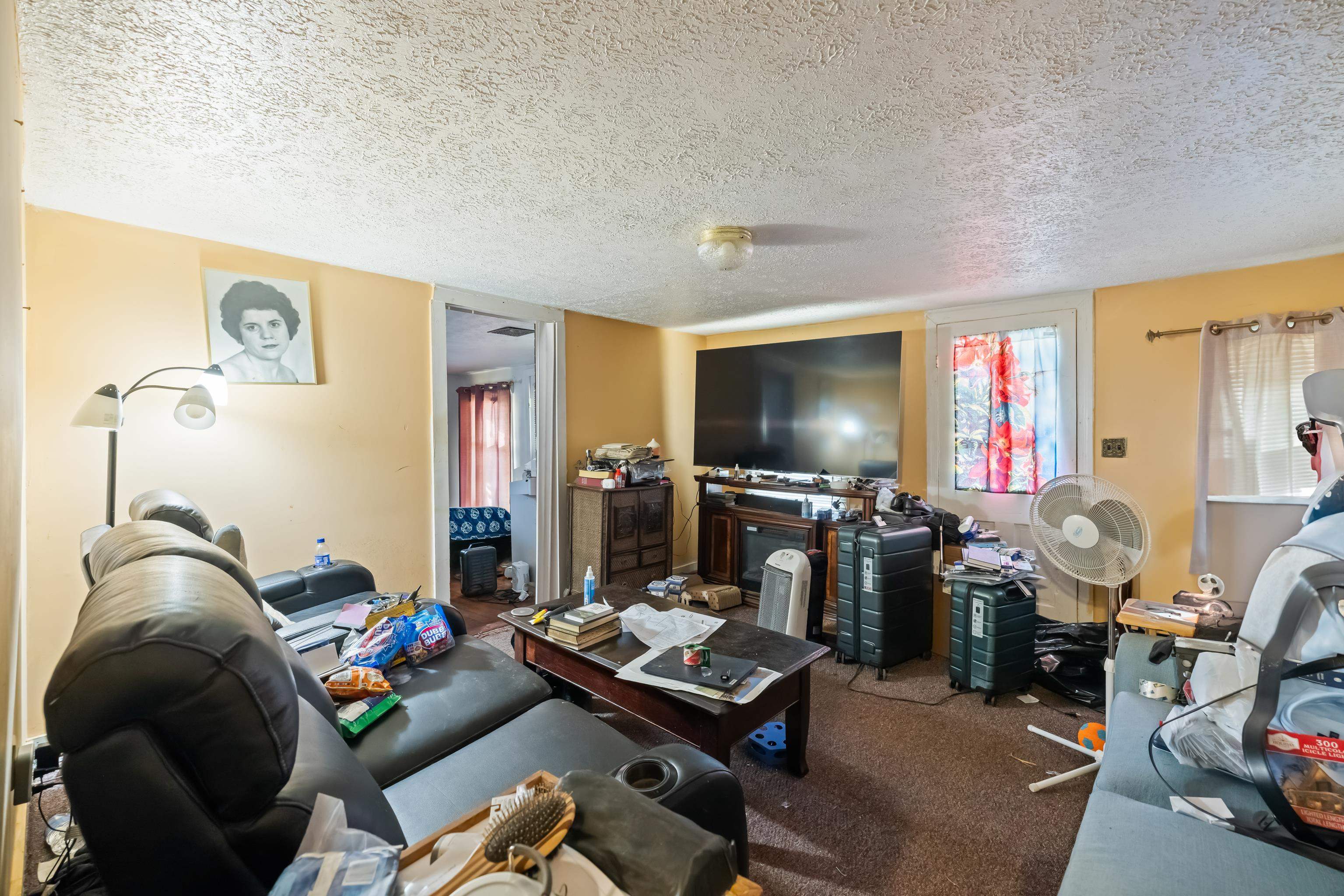 394 Ridge Road Raphine, VA 24472 - Photo 16 of 46 a living room with furniture and a flat screen tv