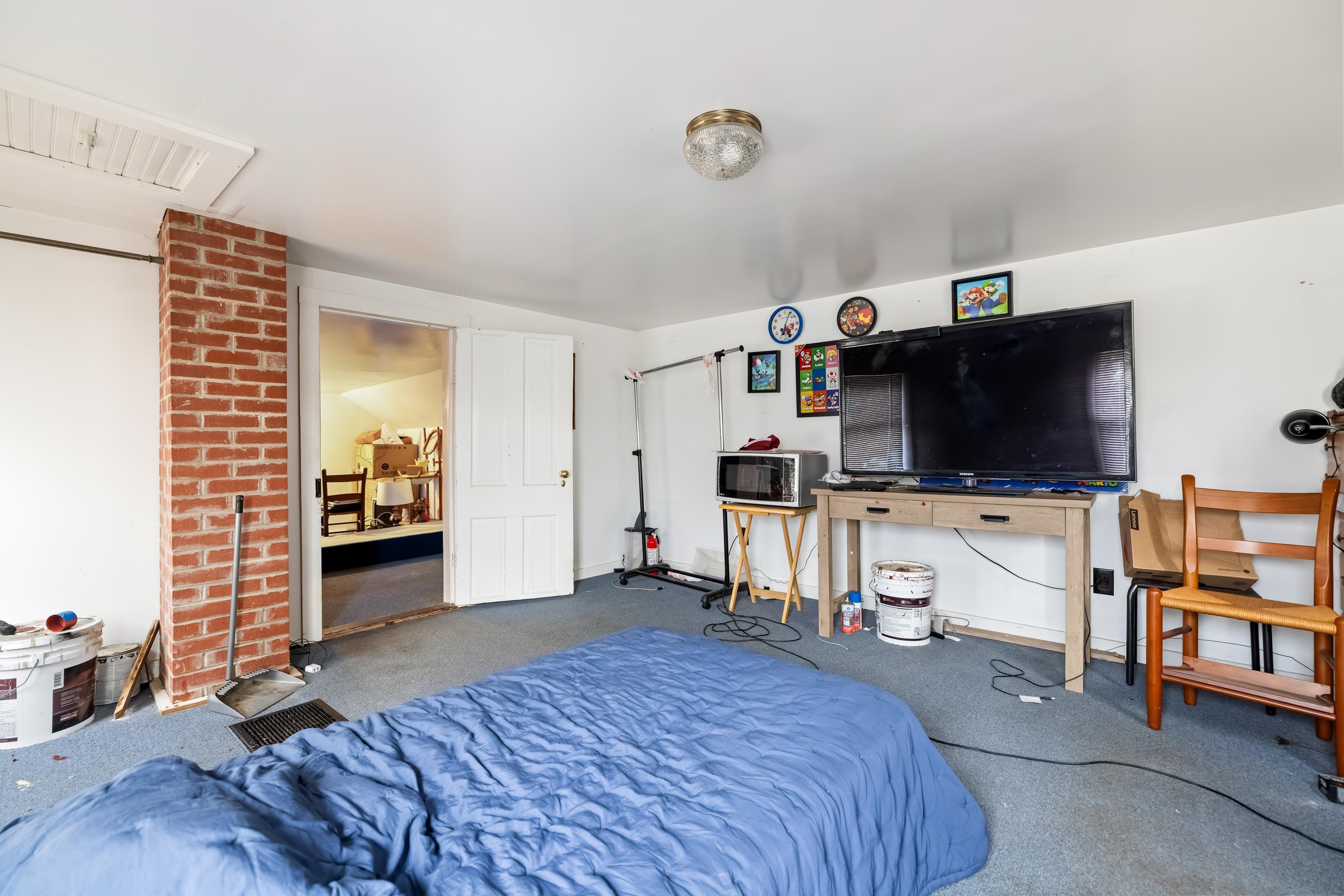 394 Ridge Road Raphine, VA 24472 - Photo 24 of 46 a bedroom with furniture and a flat screen tv