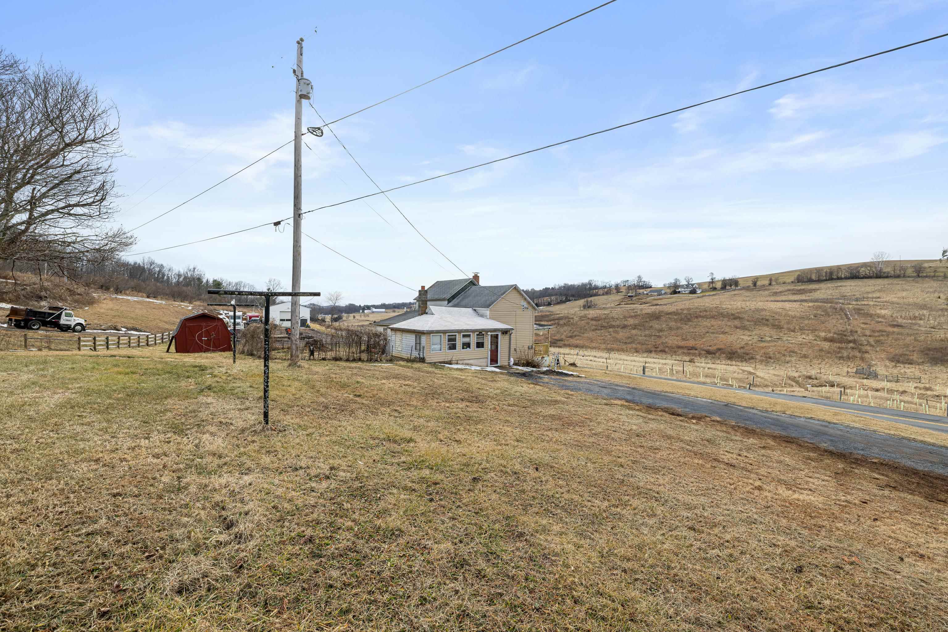394 Ridge Road Raphine, VA 24472 - Photo 35 of 46 a view of a lake with a beach