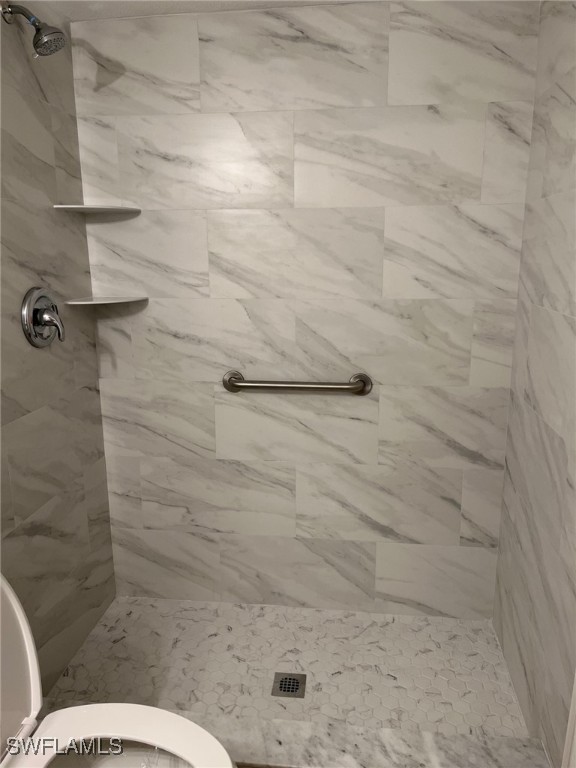 16881 Davis Road, Unit 713 Fort Myers, FL 33908 - Photo 13 of 29 a bathroom with a toilet sink and shower