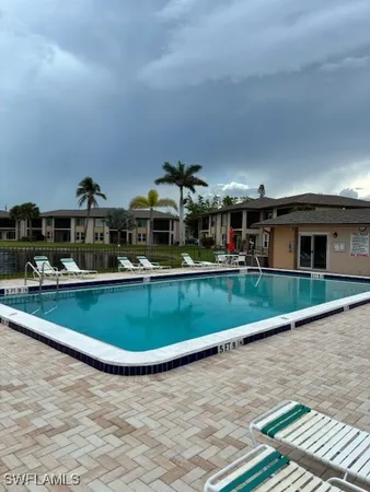 an aerial view of a house with a swimming pool