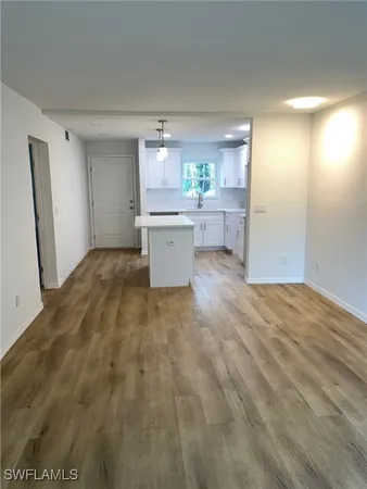 a view of a kitchen with a sink