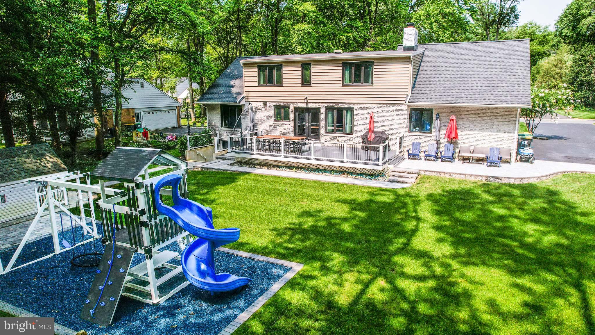 122 Hitching Post Drive Wilmington, DE 19803 - Photo 13 of 64 a view of a house with a yard patio and swimming pool