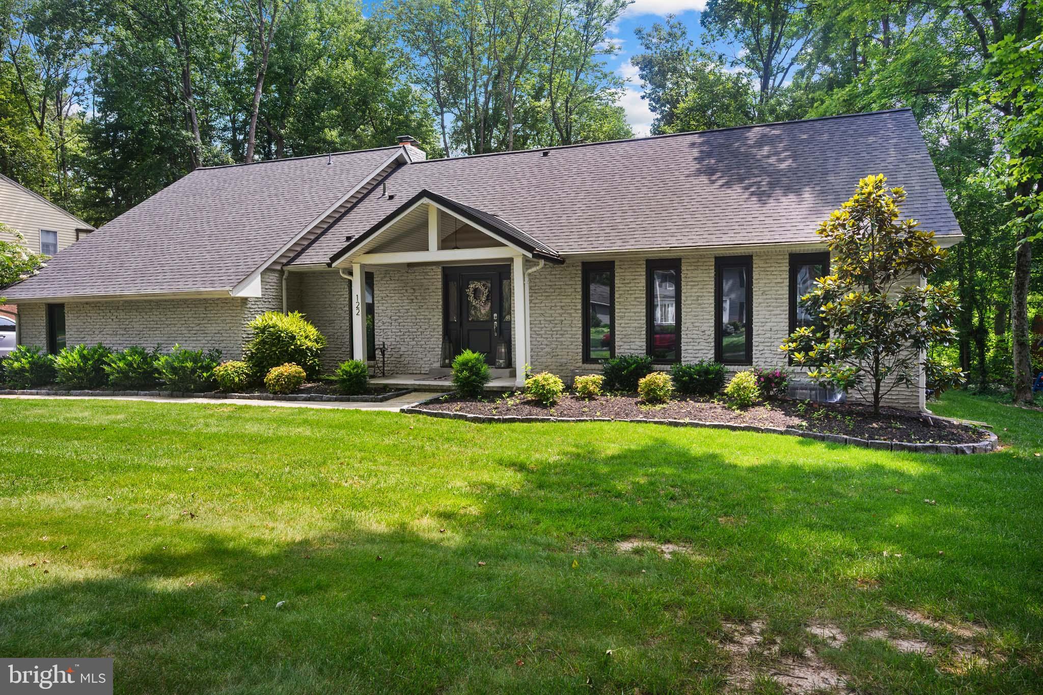 122 Hitching Post Drive Wilmington, DE 19803 - Photo 2 of 64 a front view of a house with yard and green space