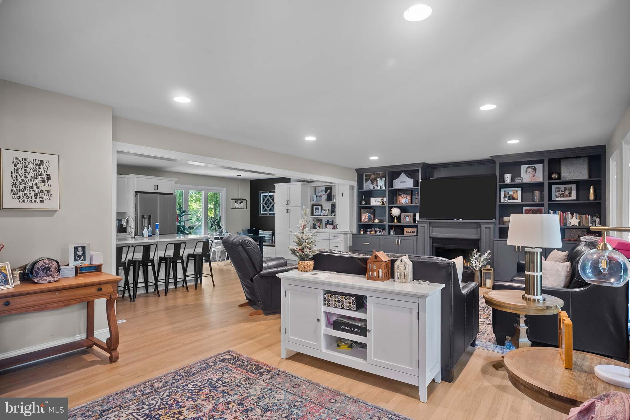 122 Hitching Post Drive Wilmington, DE 19803 - Photo 29 of 64 a living room with furniture a rug and a flat screen tv
