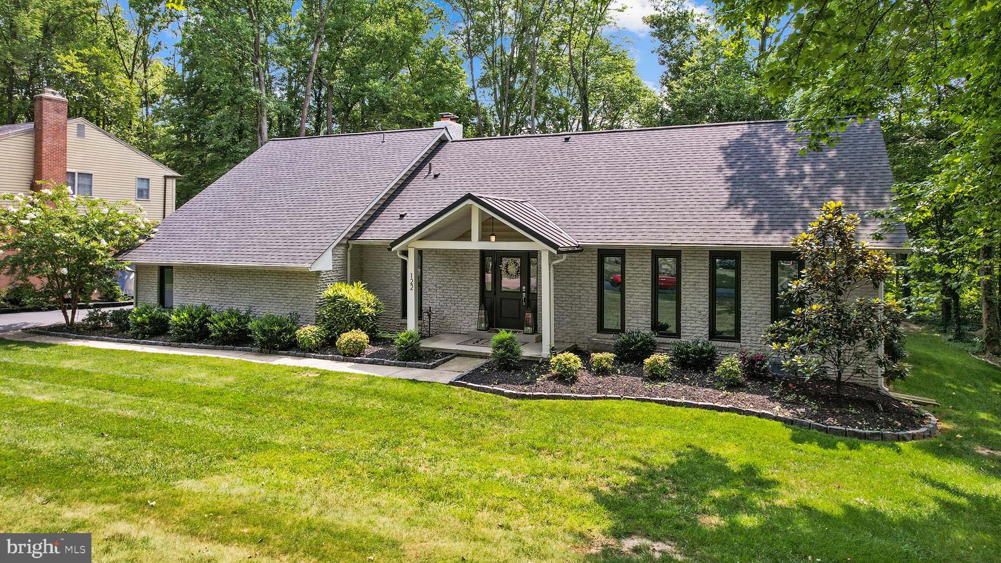 122 Hitching Post Drive Wilmington, DE 19803 - Photo 3 of 64 a front view of a house with garden