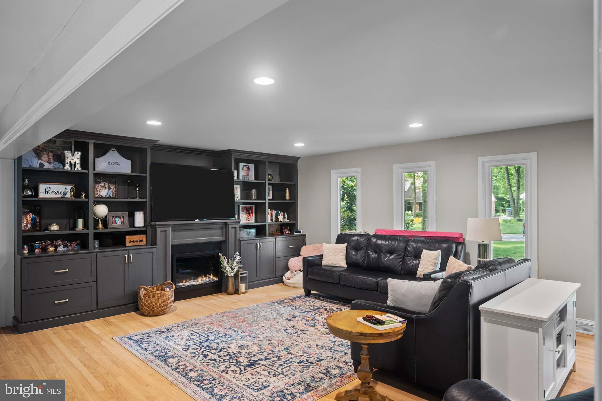122 Hitching Post Drive Wilmington, DE 19803 - Photo 31 of 64 a living room with furniture a rug and a fireplace