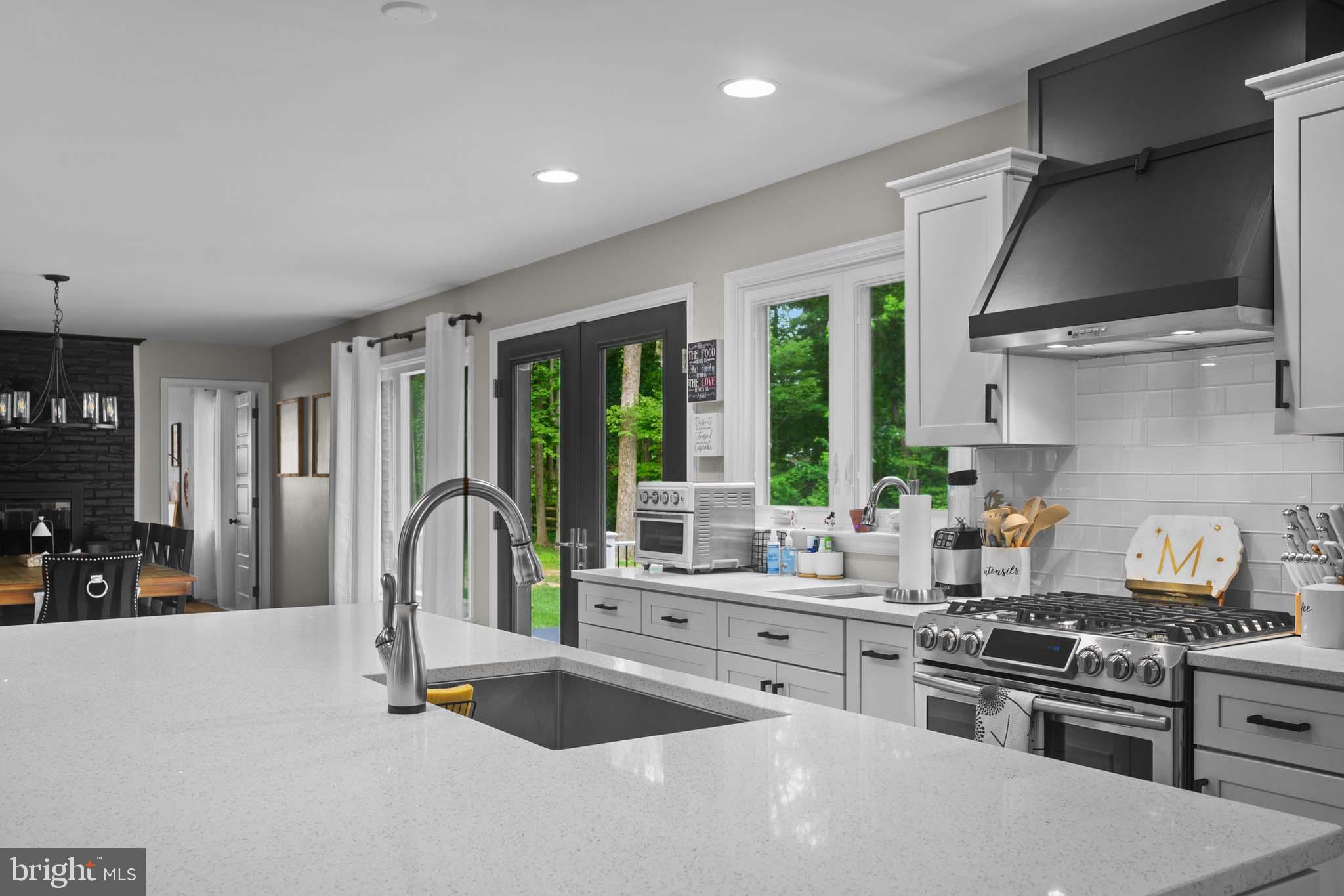 122 Hitching Post Drive Wilmington, DE 19803 - Photo 38 of 64 a kitchen with stainless steel appliances a stove sink and refrigerator