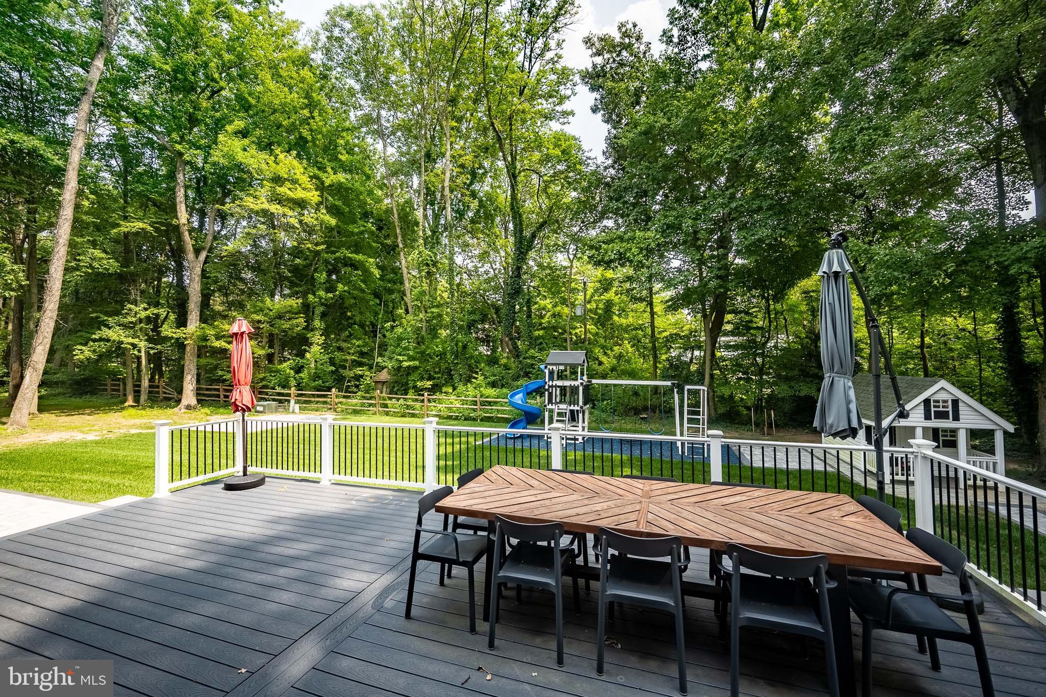 122 Hitching Post Drive Wilmington, DE 19803 - Photo 44 of 64 a view of a wooden deck and chairs