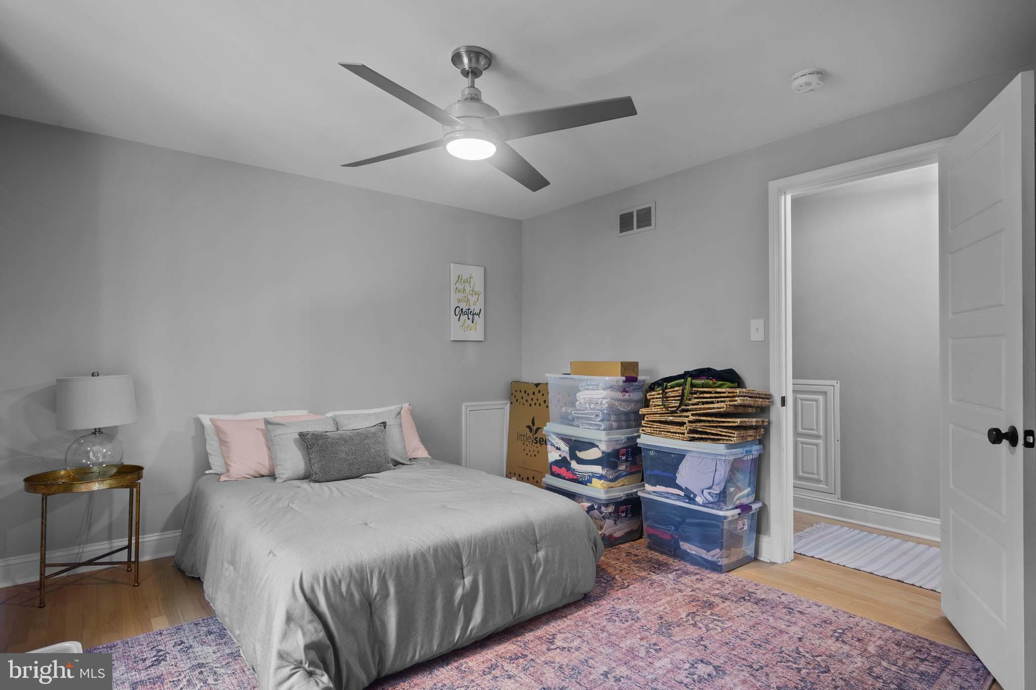 122 Hitching Post Drive Wilmington, DE 19803 - Photo 56 of 64 a bedroom with a bed and wooden floor