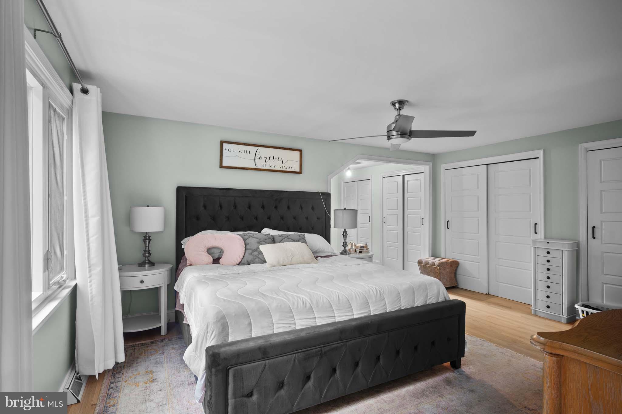 122 Hitching Post Drive Wilmington, DE 19803 - Photo 61 of 64 a bedroom with a bed and a chandelier