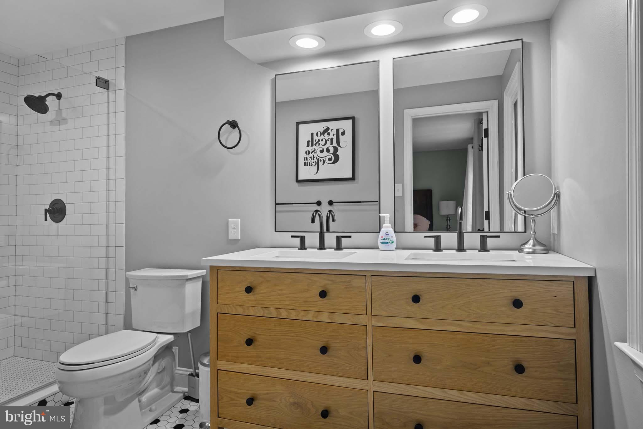 122 Hitching Post Drive Wilmington, DE 19803 - Photo 64 of 64 a bathroom with a granite countertop toilet a sink and a mirror