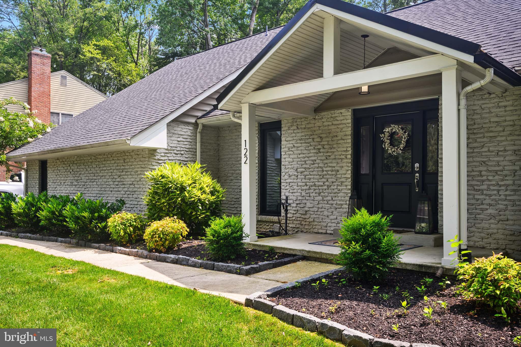 122 Hitching Post Drive Wilmington, DE 19803 - Photo 7 of 64 a front view of a house with a yard