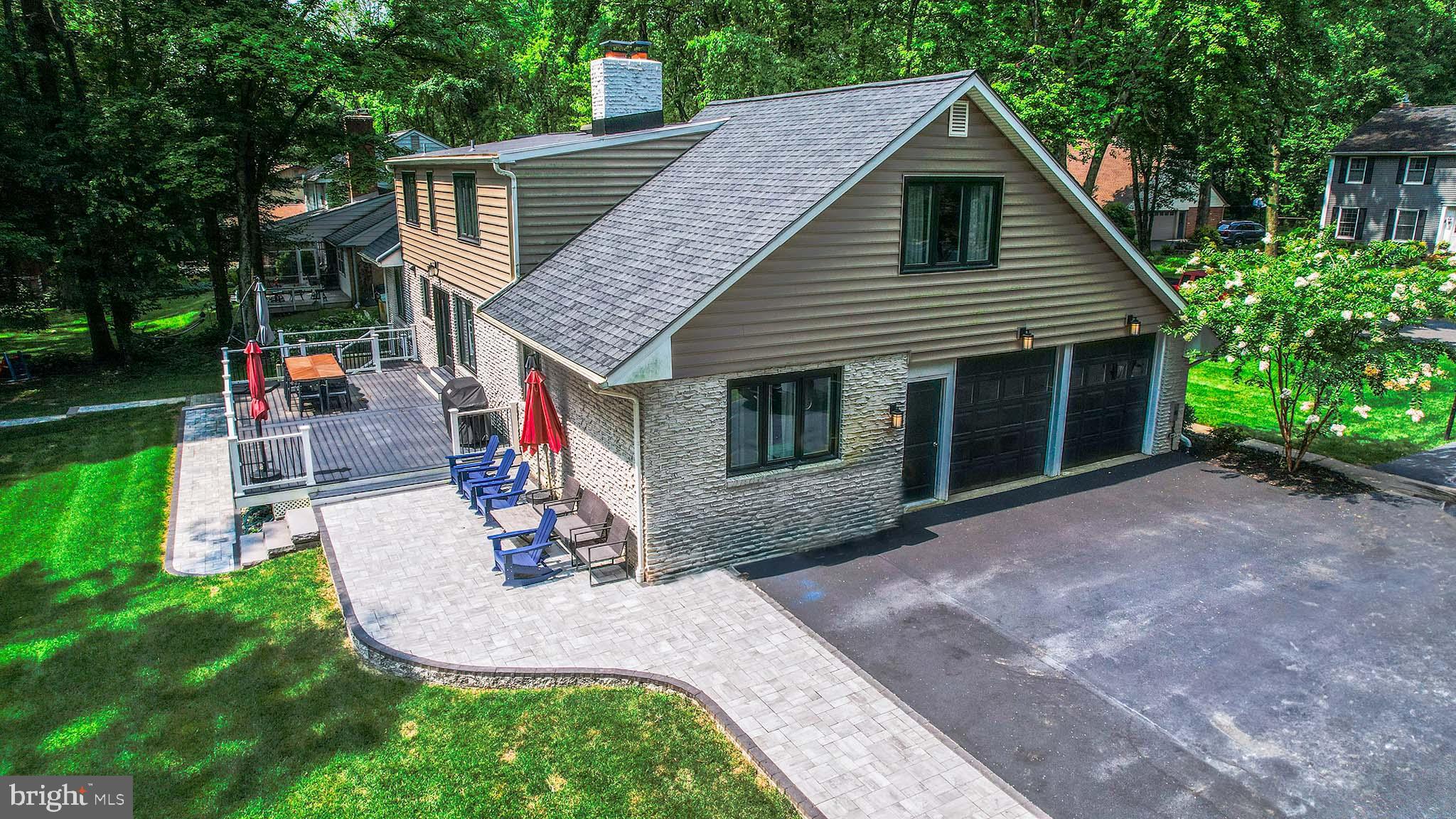 122 Hitching Post Drive Wilmington, DE 19803 - Photo 10 of 64 a view of a house with a yard patio and a garden