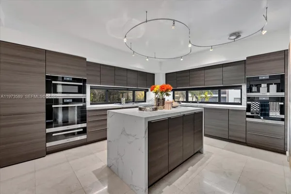 a view of a kitchen area with furniture and chandelier
