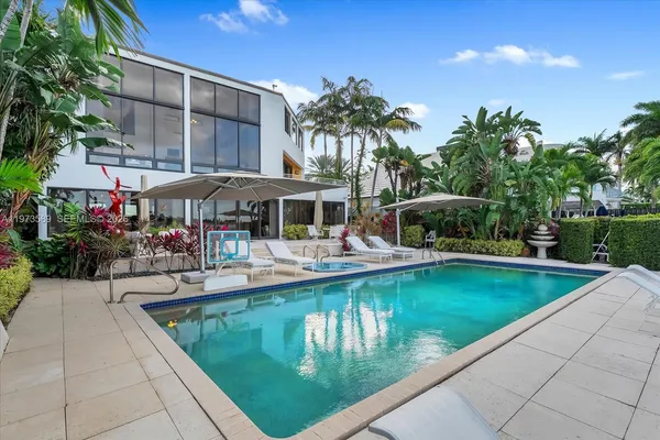 a view of a swimming pool with a patio