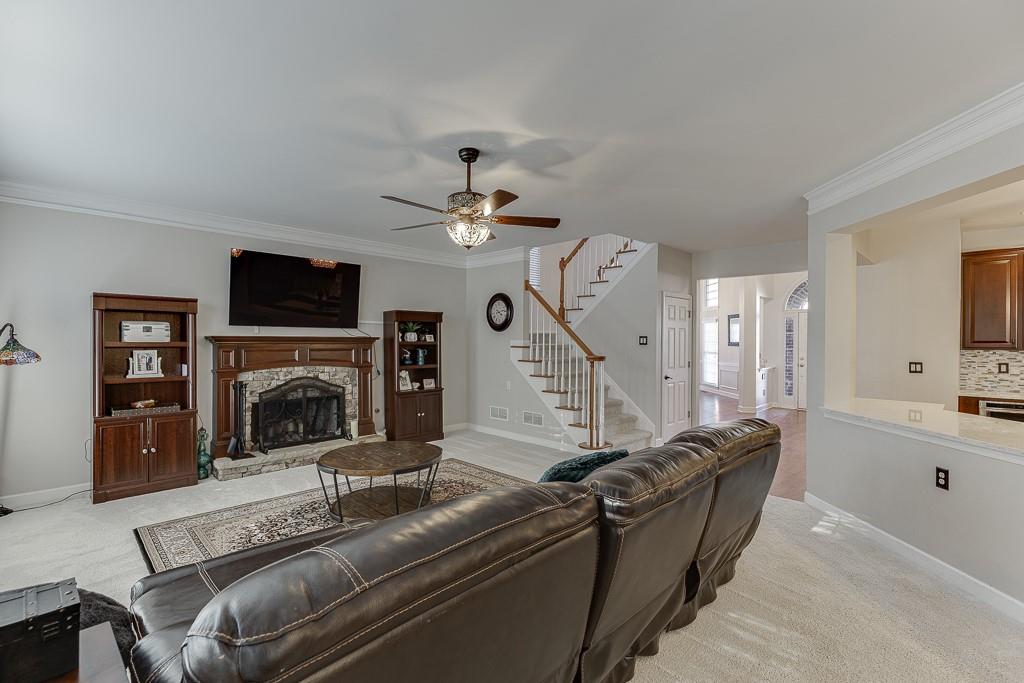 1806 Asteria Court Duluth, GA 30097 - Photo 12 of 63 a living room with furniture and a fireplace