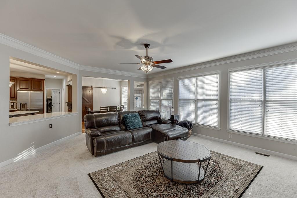 1806 Asteria Court Duluth, GA 30097 - Photo 14 of 63 a living room with furniture and a large window