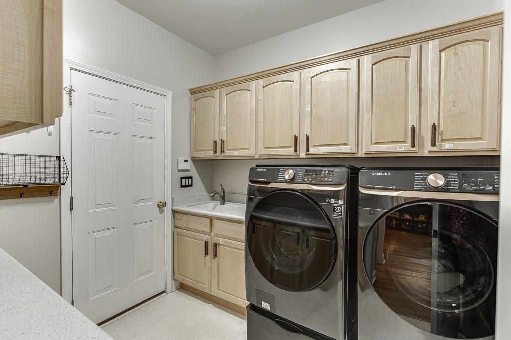 1806 Asteria Court Duluth, GA 30097 - Photo 27 of 63 a utility room with sink dryer and washer