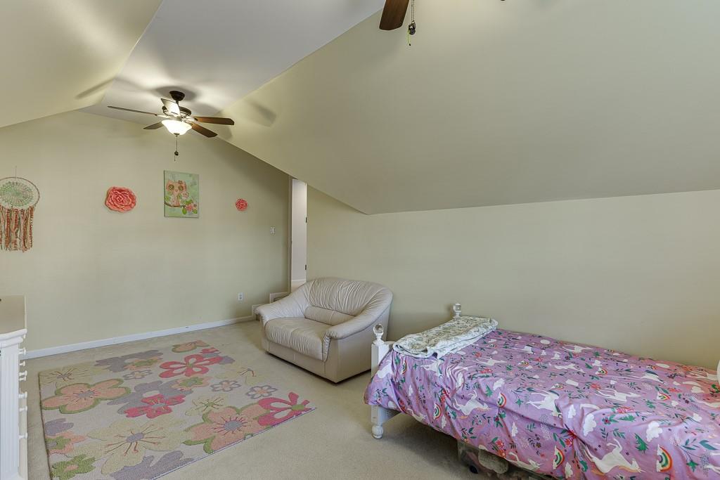 1806 Asteria Court Duluth, GA 30097 - Photo 38 of 63 a bedroom with bed and a chandelier