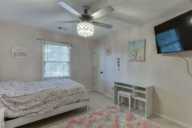 a view of a dinning table and chairs on the roof deck