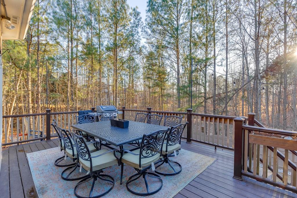 1806 Asteria Court Duluth, GA 30097 - Photo 43 of 63 a view of a dinning table and chairs on the roof deck