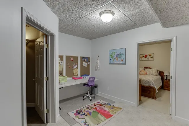 a view of water heater room with wooden floor