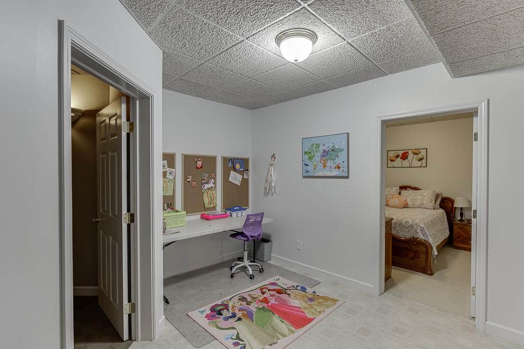 1806 Asteria Court Duluth, GA 30097 - Photo 46 of 63 a bedroom with furniture and a window