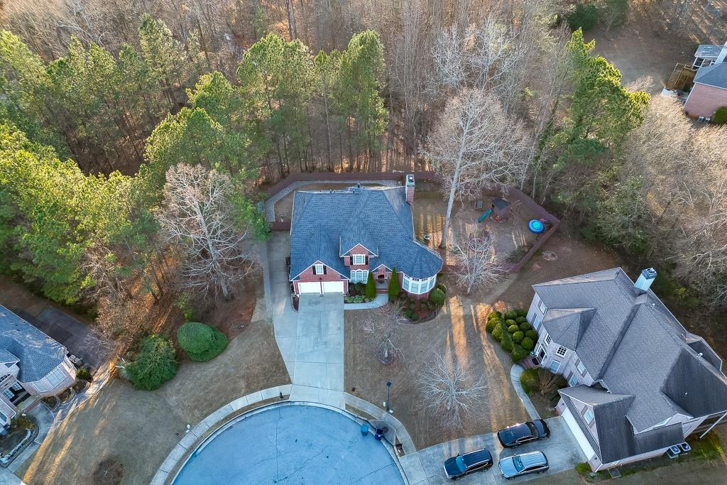 1806 Asteria Court Duluth, GA 30097 - Photo 61 of 63 an aerial view of a house with garden space and street view