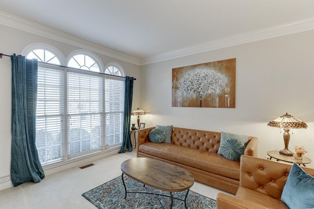 1806 Asteria Court Duluth, GA 30097 - Photo 8 of 63 a living room with furniture and a large window