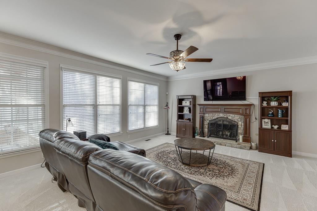 1806 Asteria Court Duluth, GA 30097 - Photo 10 of 63 a living room with furniture and a fireplace