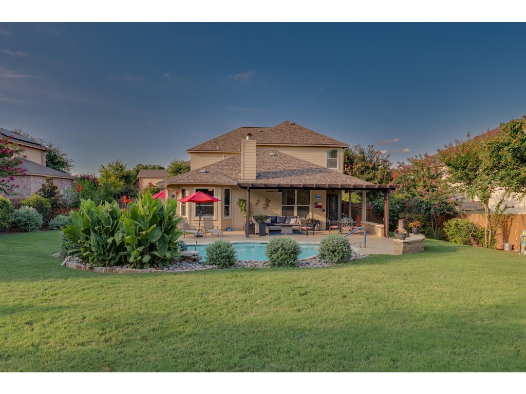 19008 Boulder Crest Drive Pflugerville, TX 78660 - Photo 1 of 1 a view of a house with garden and sitting area