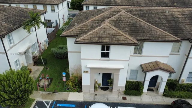 a aerial view of a house with potted plants