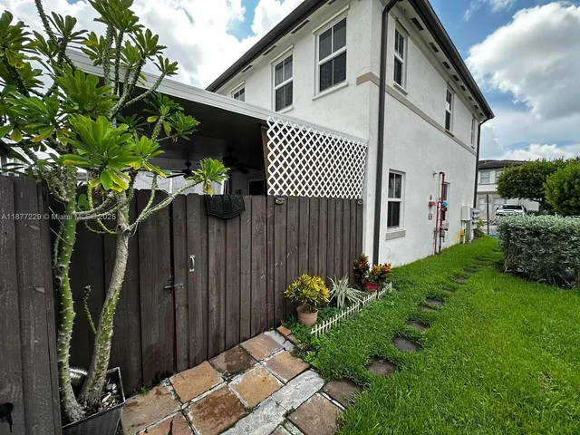 a backyard of a house with lots of green space