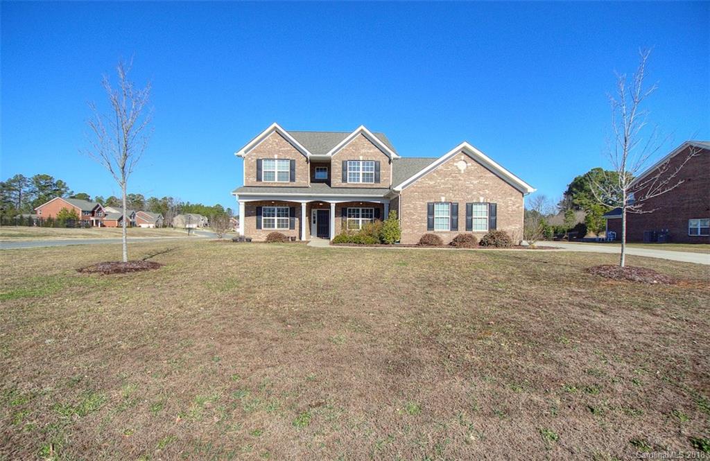 2001 Spring Rose Lane Wesley Chapel, NC 28104 - Photo 2 of 36 a front view of a house with a yard