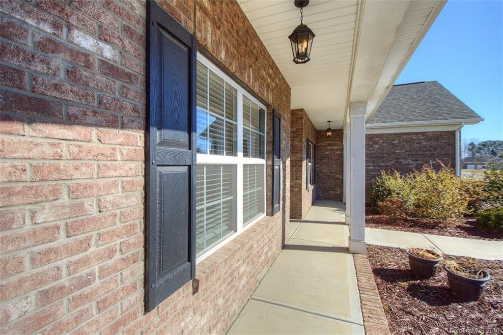 2001 Spring Rose Lane Wesley Chapel, NC 28104 - Photo 11 of 36 a view of a pathway along a building