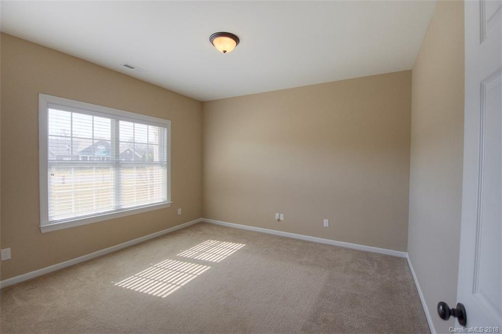 2001 Spring Rose Lane Wesley Chapel, NC 28104 - Photo 13 of 36 an empty room with a empty space and a window