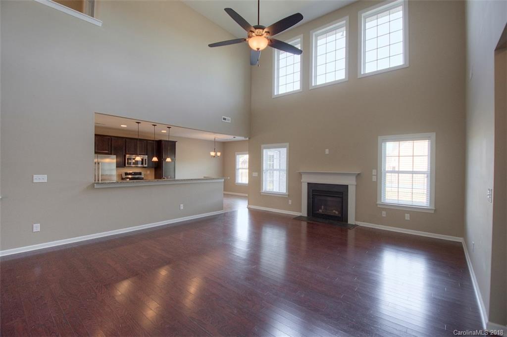 2001 Spring Rose Lane Wesley Chapel, NC 28104 - Photo 17 of 36 an empty room with windows and fireplace
