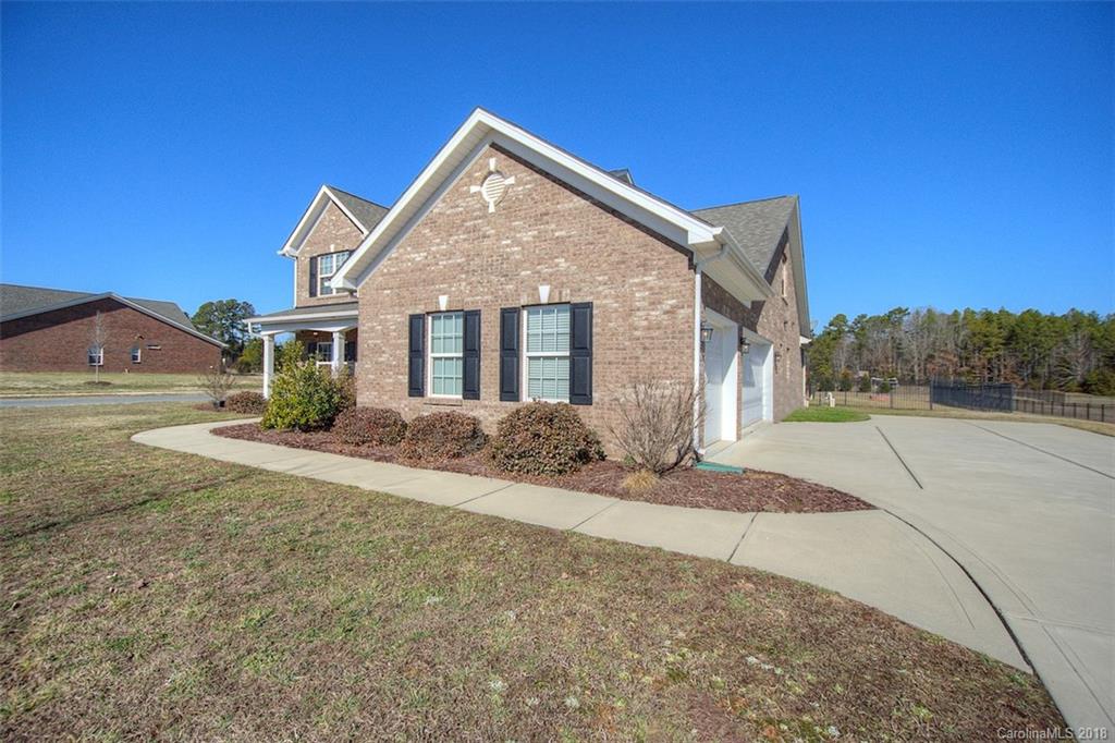 2001 Spring Rose Lane Wesley Chapel, NC 28104 - Photo 3 of 36 a front view of a house with a yard