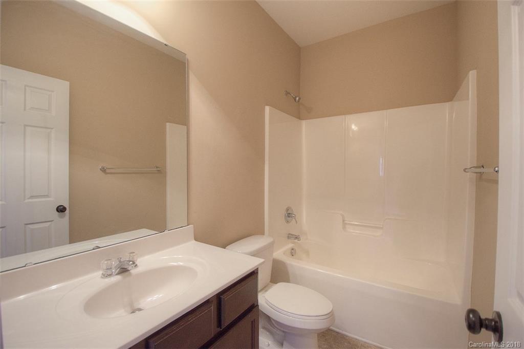2001 Spring Rose Lane Wesley Chapel, NC 28104 - Photo 27 of 36 a bathroom with a sink a toilet and shower