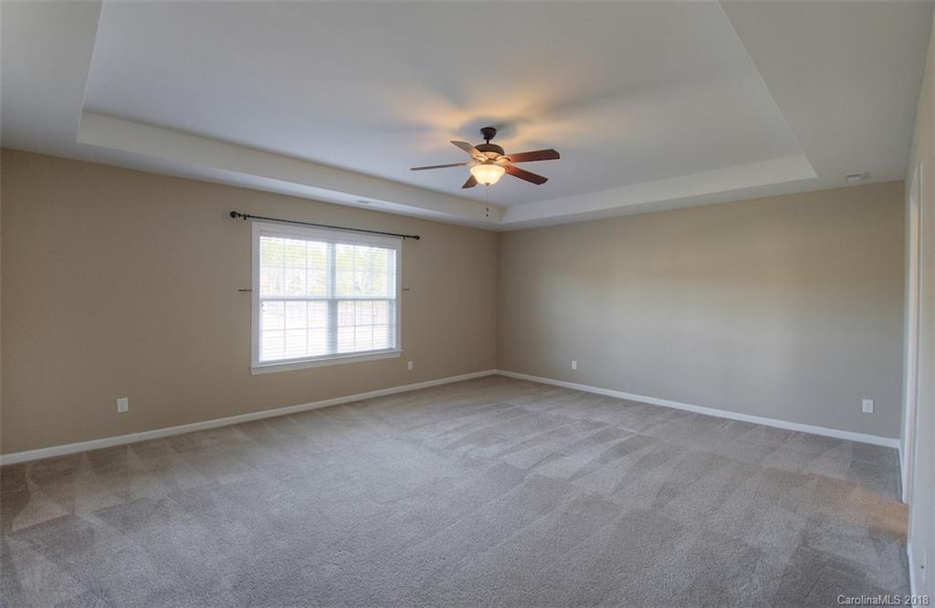 2001 Spring Rose Lane Wesley Chapel, NC 28104 - Photo 28 of 36 wooden floor in an empty room with a window