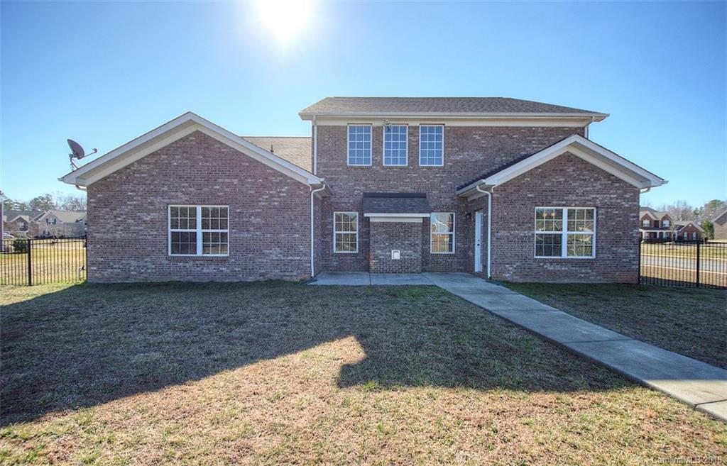 2001 Spring Rose Lane Wesley Chapel, NC 28104 - Photo 4 of 36 a front view of a house with garden